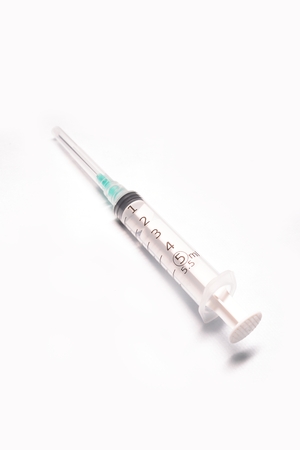 Medical syringe closeup on white background isolatedの写真素材