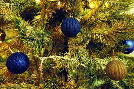 Toy angel hanging on the Christmas treeの写真素材