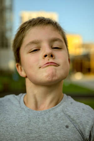 Portrait of a child who squints slylyの写真素材