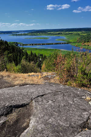 View of summer Karelia from height of hillfort on Mount Paaso near town Sortavalaの写真素材