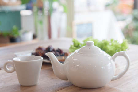 Delicious fragrant tea eaten in the morning, put it in white teapot and glassの写真素材