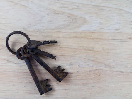 The old key on wood background.の写真素材
