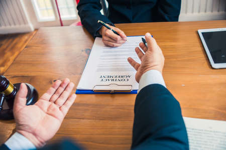 business people and lawyers discussing contract papers.Legal planning. Concepts of law, advice, legal servicesの写真素材