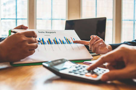Business Analysis and Strategy. Businessman work with calculator on table in office work with paper graph chart business marketing plan analysisの写真素材