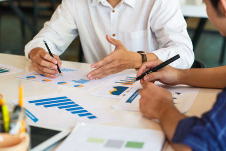 Business Corporate team brainstorming with chart and checking and analysisの写真素材