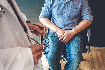 Doctors are consulting with young men about prostate cancer and venereal disease, including sexual dysfunction.Men Health Conceptの写真素材