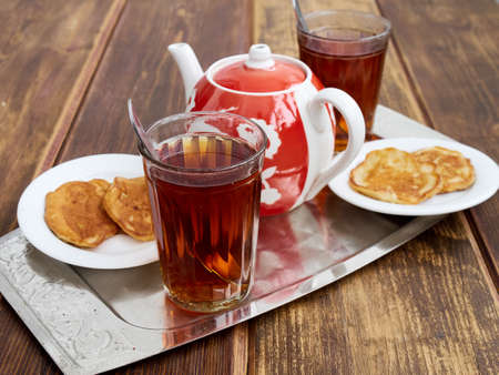glassful teapot tea pancakes in Russian styleの写真素材