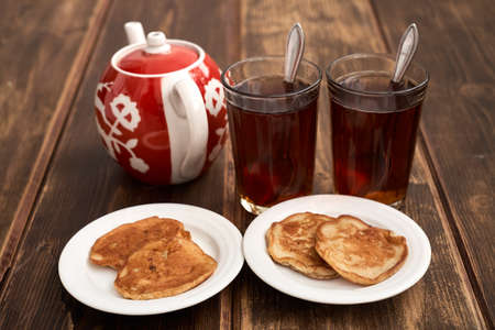 glassful teapot tea pancakes in Russian styleの写真素材