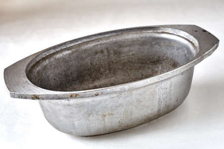 old cast-iron pan of a frying pan with traces of long-term useの写真素材