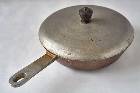 old cast-iron pan of a frying pan with traces of long-term useの写真素材