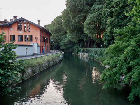Park near the canal with a path for cyclists and runners, Europe, Italy,        Cernusco sul Naviglioの写真素材