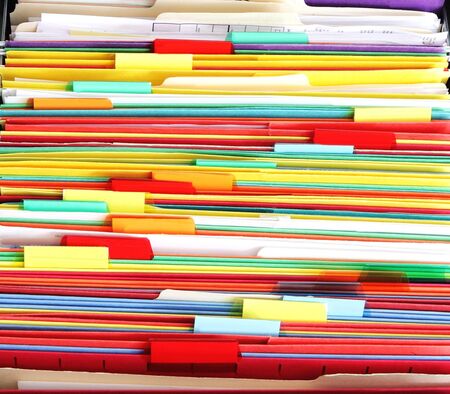 Colorful file folder in the drawer for asbtrast background
