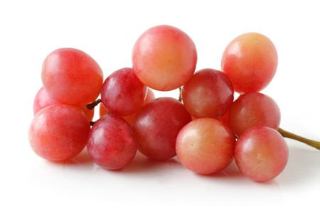 Fresh red global grape fruits isolated on whiteの写真素材