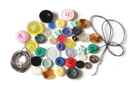 Colorful buttons in different shapes and thread