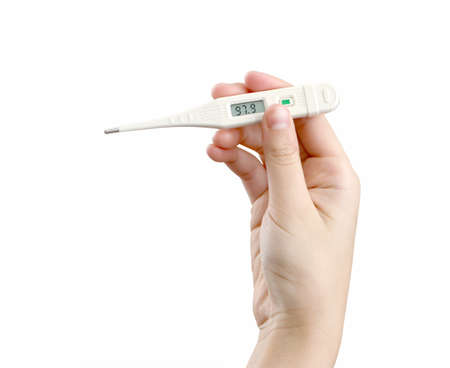 A hand holding a thermomether that shows a normal temperature