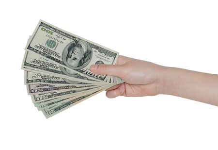 Hand holding US money isolated on white backgroundの写真素材