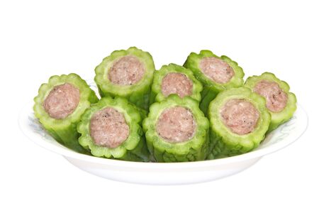Bitter melon stuffed with ground pork isolated on whiteの写真素材