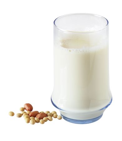 Glass of soy bean milk and peanut isolated on whiteの写真素材