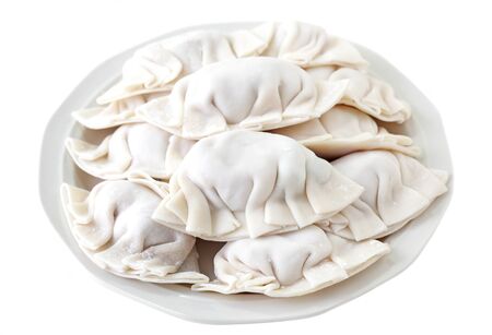 Plate of fresh dumplings isolated on whiteの写真素材