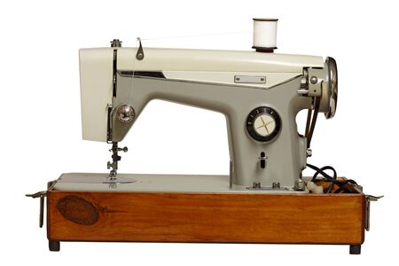Old sewing machine isolated on white background