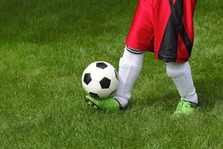 Football player guggling a soccerballのeditorial素材