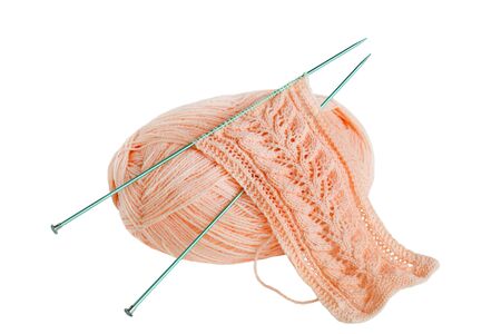 Knitting a scarf with yarn and needle isolated on whiteの写真素材