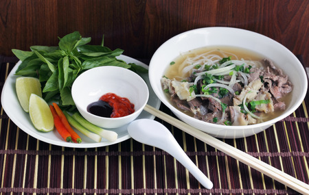 Pho Beef noodle soup eating with basilの写真素材