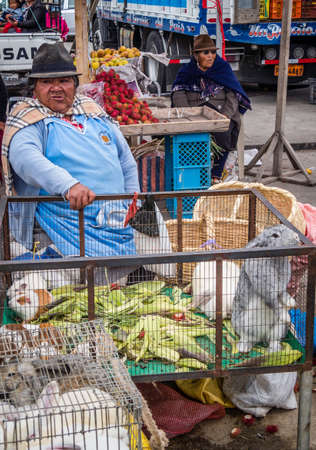 Saquisili, Ecuador - May 2, 2019 - indigenous lady selling in the Saquisili market in the Cotopaxi region of Ecuador, South Americaのeditorial素材