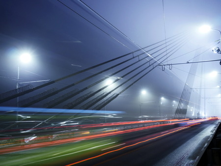 Bridge lights in fog in Riga, Latviaの写真素材