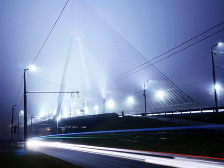 Bridge lights in fog in Riga, Latviaの写真素材