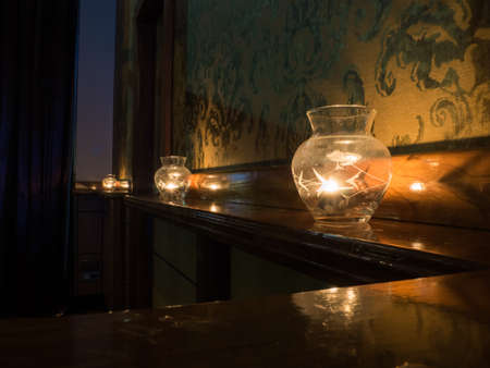 Christmas decoration with candles over dark backgroundの写真素材