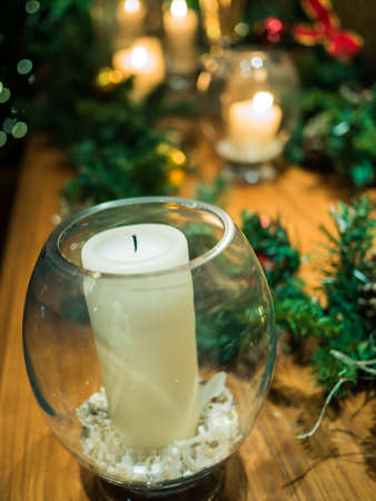 Christmas decoration with candles over dark backgroundの写真素材