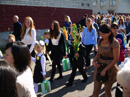 Children with flowers in front of the School No. 68 on the first day of school on September 1, 2014...