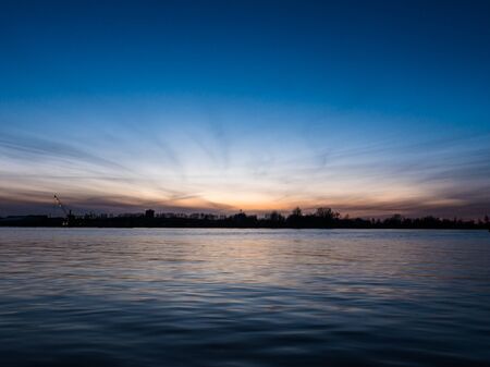 Sunset over the river Daugava in Riga, Latviaの写真素材