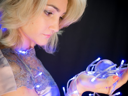 studio Photo of beautiful woman in dress on black backgroundの写真素材