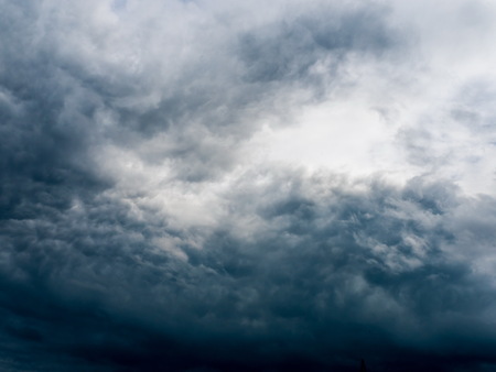 dark storm clouds before rain at summer timeの写真素材