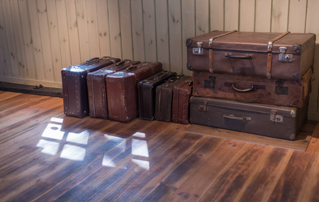 old Vintage Suitcase in the room with wooden floorの写真素材