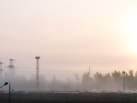 foggy train station terminal in the evening