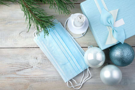 Medical protective masks on a Christmas background. The view from the top. The concept of safe holidays.の写真素材
