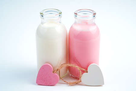 Hearts and two bottles of milk drink. Concept of drinks, holiday backgrounds.の写真素材