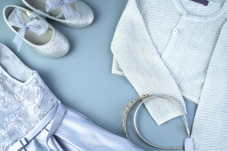 Set of childrens clothing for the holiday on a gray-blue background. The view from the top. The concept of childrens clothing.の写真素材