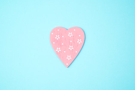 Pink heart on a blue background. Top view, with space to copy. Concept February 14, love.の写真素材