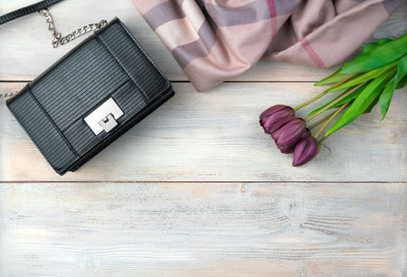 March 8, Holiday background with flowers, Bag, scarf wooden background. Top view with space to copy. Concept of March 8.の写真素材