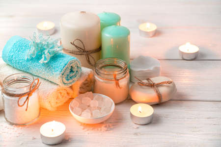 Atmospheric spa composition with burning candles. Cleaning kit. Top view with copy space.の写真素材