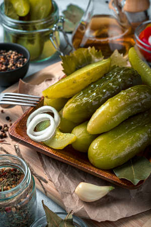 Pickled cucumbers close-up on a gray background. Culinary background.の写真素材