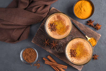 Milk dessert with cinnamon, coffee and turmeric. Cinnamon pudding. Top view, close-up.の写真素材