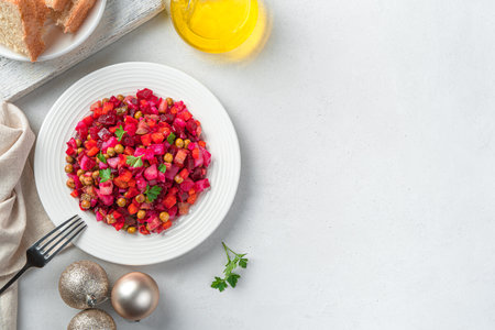 Vegetable salad with peas and herbs on a gray background. Traditional festive salad - vinaigrette. Top view, horizontal.の写真素材
