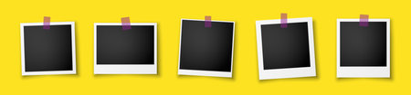 A set of five retro photo frames with black inserts and sticky tapes on a yellow background. Vintage...