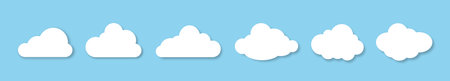 A set of fluffy clouds with a shadow on a blue background. Design elements for weather forecasting, web interface, or cloud-based data storage applications. Vector EPS 10.のイラスト素材