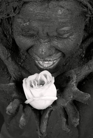 portrait of crying dirty girl holding roseの写真素材